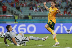 Wales' midfielder Aaron Ramsey scores the opening goal during the UEFA EURO 2020 Group A football match between Turkey and Wales at the Olympic Stadium in Baku on June 16, 2021.