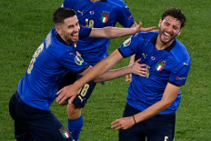 Italy's midfielder Manuel Locatelli (right) celebrates with Italy's midfielder Jorginho after he scored the team's second goal during the UEFA EURO 2020 Group A football match between Italy and Switzerland at the Olympic Stadium in Rome on June 16, 2021. 
