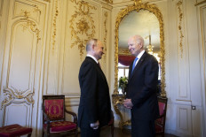 US President Joe Biden (right) talks to Russian President Vladimir Putin prior to the US-Russia summit at the Villa La Grange, in Geneva on June 16, 2021. 