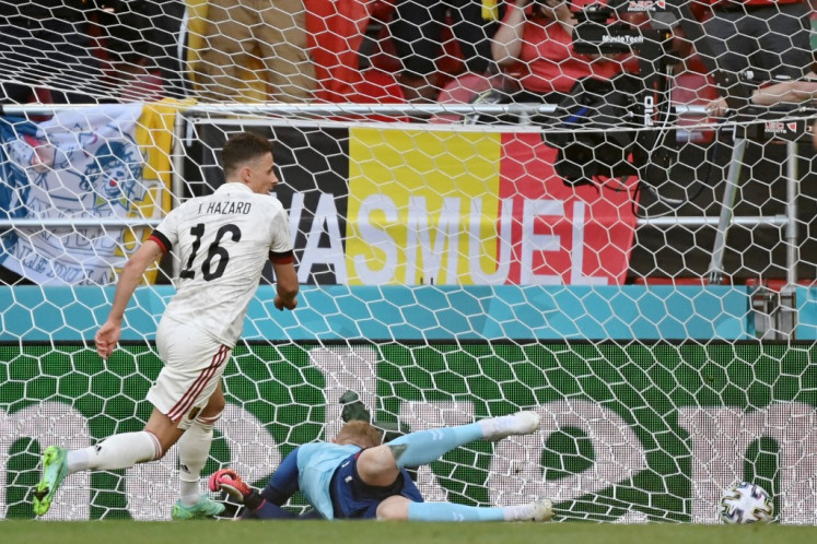 Belgium's midfielder Thorgan Hazard scores the team's first goal during the UEFA EURO 2020 Group B football match between Denmark and Belgium at the Parken Stadium in Copenhagen on June 17, 2021. (AFP/Jonathan Nackstrand).
Usage: 0