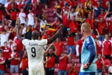 Belgium's forward Romelu Lukaku (left) celebrates after his team's second goal during the UEFA EURO 2020 Group B football match between Denmark and Belgium at the Parken Stadium in Copenhagen on June 17, 2021.

