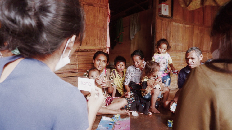 Direct education: Members of the 1000 Days Fund visit a family in Surunumgbeng village, 89 kilometers from West Manggarai regency's capital of Labuan Bajo. The NGO's stunting prevention program includes door-to-door awareness campaigns.