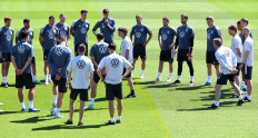 Germany's coach Joachim Loew (C) speaks to his players during a training session at the team's training camp in Herzogenaurach on June 17, 2021, during the EURO 2020 football championship.