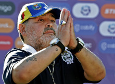 In this file photo taken on November 02, 2019 Gimnasia y Esgrima team coach Diego Armando Maradona gestures to supporters as he leaves the field after an Argentina First Division Superliga football match against Estudiantes, at El Bosque stadium, in La Plata, Buenos Aires province, Argentina.
