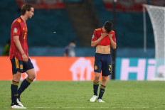 Spain's players react to their draw in the UEFA EURO 2020 Group E football match between Spain and Poland at La Cartuja Stadium in Seville, Spain, on June 19, 2021. 