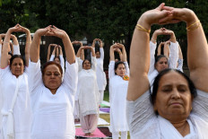 Free Covid vaccines for all Indian adults as Modi hails yoga 'shield'