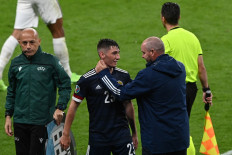 Scotland's midfielder Billy Gilmour (center) and Scotland's coach Steve Clarke (right) react after the UEFA EURO 2020 Group D football match between England and Scotland at Wembley Stadium in London on June 18, 2021.FACUNDO ARRIZABALAGA / POOL / AFP
