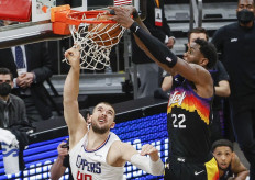 Deandre Ayton #22 of the Phoenix Suns dunks the ball over Ivica Zubac #40 of the LA Clippers during the fourth quarter in game two of the NBA Western Conference finals in-which the Phoenix Suns defeated the LA Clippers 104-103 at Phoenix Suns Arena on June 22, 2021 in Phoenix, Arizona.