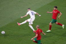 France's forward Karim Benzema scores the team's second goal during the UEFA EURO 2020 Group F football match between Portugal and France at Puskas Arena in Budapest on June 23, 2021.
