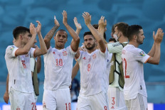 Spain's players celebrate their victory after the UEFA EURO 2020 Group E football match between Slovakia and Spain at La Cartuja Stadium in Seville on June 23, 2021. 