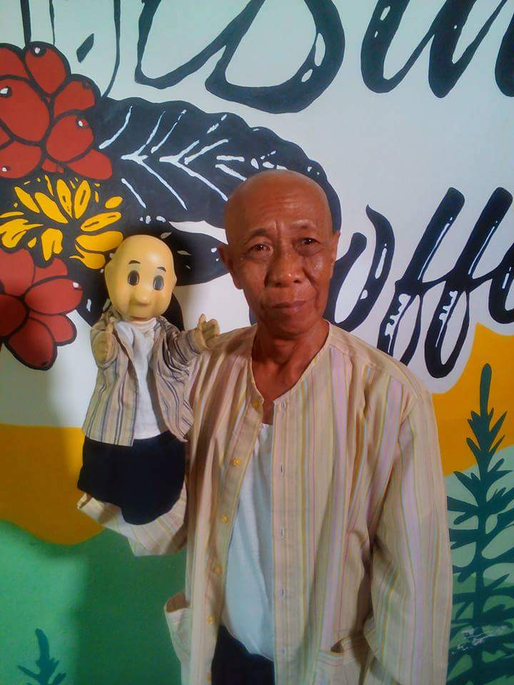 Mini me: Abdul Hamid holds the Pak Ogah puppet that appears in the Unyil children's series.
