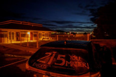 A message honouring the 215 children whose remains were discovered buried in unmarked graves near the The former Kamloops Indian Residential School, in Kamloops.
