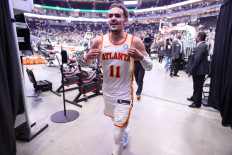 Trae Young #11 of the Atlanta Hawks walks off the court after the game against the Milwaukee Bucks during Game 1 of the Eastern Conference Finals of the 2021 NBA Playoffs on June 23, 2021 at the Fiserv Forum Center in Milwaukee, Wisconsin.