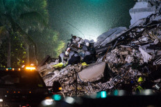 Nearly 100 people missing as oceanfront Miami-area building collapses