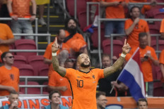 Netherlands' forward Memphis Depay celebrates scoring the opening goal from the penalty spot during the UEFA EURO 2020 Group C football match between the Netherlands and Austria at the Johan Cruyff Arena in Amsterdam on June 17, 2021.
