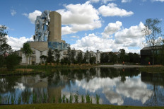 A picture taken on June 24, 2021 in Arles, southern France shows a view of the twisting tower clad in reflective aluminum tiles, designed by Canadian-American architect Frank Gehry. The Luma Foundation is located at the Parc des Ateliers, a former SNCF railway workshop turned into an 