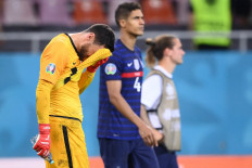 France's goalkeeper Hugo Lloris reacts after their defeat in the UEFA EURO 2020 round of 16 football match between France and Switzerland at the National Arena in Bucharest on June 28, 2021. 