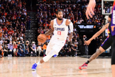 Paul George #13 of the LA Clippers dribbles the ball during the game against the Phoenix Suns during Game 5 of the Western Conference Finals of the 2021 NBA Playoffs on June 28, 2021 at Phoenix Suns Arena in Phoenix, Arizona.