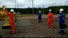 Operators open a valve to release the first gas of the South Jambi B Block on June 24, 2021.