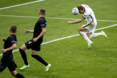 England's forward Harry Kane (right) scores the second goal during the UEFA EURO 2020 round of 16 football match between England and Germany at Wembley Stadium in London on June 29, 2021. 