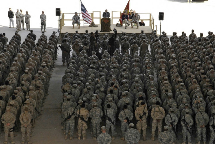 A Photo released by the US Departmet of Defence shows outgoing US Secretary of Defence Donald Rumsfeld addressing service members at a Town Hall meeting with troops assigned to Al-Asad Air Base in Iraq's restive Al-Anbar province during a surprise visit to Iraq, 09 December 2006. Rumsfeld made a surprise farewell visit to Iraq, urging American troops to stay the course in the face of a critical US report about the conduct of the war. Rumsfeld, who resigned in November in the wake of the Republican Party's defeat in congressional polls that has been largely blamed on US war policy, visited two US bases, according to the Pentagon website. 