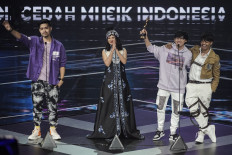Making their mark: Electropop group Weird Genius celebrate as they win Best of the Best Song Production at the 2020 AMI Awards on Nov. 26, unseating perennial champions NOAH and Yovie Widianto.