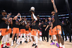 Chris Paul #3 of the Phoenix Suns holds the Western Conference Finals trophy after Game 6 of the Western Conference Finals of the 2021 NBA Playoffs on June 30, 2021 at STAPLES Center in Los Angeles, California.