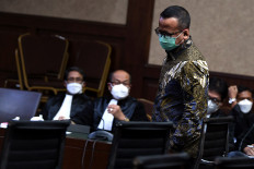 Former Maritime and Fisheries Affairs Minister and bribery defendant Edhy Prabowo takes his seat during his trial at the Jakarta Corruption Court on June 29, 2021. He stands trial for allegedly accepting bribes amounting Rp 34 billion (US$2.3 million) and $100,000 in exchange for the issuance of a permit to export lobster larvae.