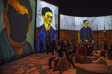 People attend the inauguration of the exhibition "Frida, the immersive experience" in Mexico City on July 6, 2021.