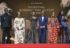 Chadian director Mahamat-Saleh Haroun (3rdR) poses with Chadian actresses Hadje Fatime Ngoua (2ndL), Rihane Khalil Alio (3rdL) and Achouackh Abakar Souleymane (2ndR) and Bria Gomdigue for the screening of the film "Lingui" (The Sacred Bonds) at the 74th edition of the Cannes Film Festival in Cannes, southern France, on July 8, 2021.