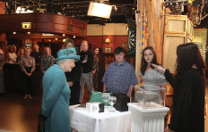 Queen Elizabeth treads cobbles on set of longest-running soap