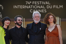 Israeli Director Ari Folman (2ndR) arrives with Israeli illustrator Lena Guberman (R), South Korean-born US musician Karen O (L) and US musician Ben Goldwasser for the screening of the film "Where Is Anne Frank" at the 74th edition of the Cannes Film Festival in Cannes, southern France, on July 9, 2021.