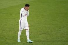 England's forward Jadon Sancho reacts after missing his penalty during the UEFA EURO 2020 final football match between Italy and England at the Wembley Stadium in London on July 11, 2021. 