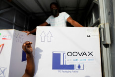 Boxes of Oxford/AstraZeneca coronavirus disease (COVID-19) vaccines, redeployed from the Democratic Republic of Congo, arrive at a cold storage facility in Accra, Ghana on May 7, 2021.