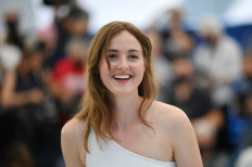 Norwegian actress Renate Reinsve smiles during a photocall for the film "Verdens Verste Menneske" (The Worst Person In The World) at the 74th edition of the Cannes Film Festival in Cannes, southern France, on July 9, 2021.