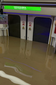 This handout photo taken on July 20, 2021 and received on July 21 courtesy of Weibo user merakiZz-, shows a submerged subway car following heavy rains in Zhengzhou, in China's central Henan province. 