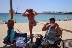 Barcelona helps disabled beachgoers frolic in waves
