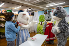 This picture taken on June 5, 2021 shows Choko Ohira teaching during a mascot acting class at Choko.Group in Tama city of Tokyo. Tokyo 2020's cutesy Olympic mascots are plastered across the host city, but they have competition in mascot-mad Japan, where cuddly characters promote everything from prisons to health screenings.