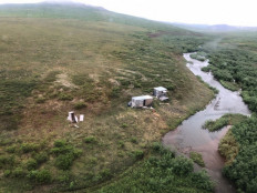 This handout image provided by the US Coast Guard, shows a remote mining camp near Nome, Alaska, where a Coast Guard Air Station Kodiak aircrew rescued the survivor of a bear attack, on July 16, 2021.