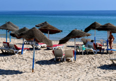 Tourists are seen along a hotel beach in Tunisia's coastal city of Sousse, about 140 kilometres south of the capital, on July 21, 2021.