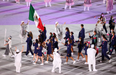 The Tokyo 2020 Olympics Opening Ceremony - Olympic Stadium, Tokyo, Japan - July 23, 2021. Rommel Pacheco Marrufo of Mexico and Gabriela Lopez of Mexico lead their team during the opening ceremony 
