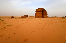 A picture taken on April 1, 2018 shows a view of the Qasr al-Farid tomb (The Lonely Castle) carved into rose-coloured sandstone in Madain Saleh, a UNESCO World Heritage site, near Saudi Arabia's northwestern town of al-Ula. Al-Ula, an area rich in archaeological remnants, is seen as a jewel in the crown of future Saudi attractions as the austere kingdom prepares to issue tourist visas for the first time -- opening up one of the last frontiers of global tourism. Saudi Crown Prince Mohammed bin Salman is set to sign a landmark agreement with Paris on April 10, 2018 for the touristic and cultural development of the northwestern site, once a crossroads of ancient civilisations. 