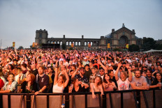 Festival-goers attend the Kaleidoscope Festival in Alexandra Palace Park in London on July 24, 2021. The one-day Kaleidoscope festival is set to play a full-line up in one of the first large festival events to take place in England since the lifting of almost all Covid-19 restrictions.