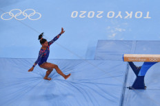 In this file photo taken on July 25, 2021 USA's Simone Biles competes in the artistic gymnastics balance beam event of the women's qualification during the Tokyo 2020 Olympic Games at the Ariake Gymnastics Centre in Tokyo. Simone Biles withdrew from Olympics all-around gymnastics on July 28, 2021.
