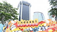 Fitch Ratings has said it may downgrade PT Indosat Ooredoo's credit rating because of the possibility of decreased financial support from a major shareholder, following the publicly listed telecommunications company's announcement of a planned merger with competitor PT Hutchison 3 Indonesia.