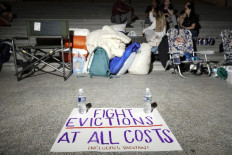 A sign calling for fighting evictions is set on the ground as Rep. Cori Bush (D-MO) spends the night outside the U.S. Capitol to call for for an extension of the federal eviction moratorium on July 31, 2021 in Washington, DC.