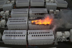 This handout picture taken on July 30, 2021 and released on August 2 by Fire Rescue Victoria shows a fire from a 13-tonne lithium battery unit at a Tesla battery site near Geelong, about an hour's drive from Melbourne. 