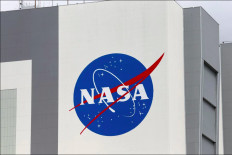The NASA logo is seen at Kennedy Space Center ahead of the NASA/SpaceX launch of a commercial crew mission to the International Space Station in Cape Canaveral, Florida, U.S., April 16, 2021. 

