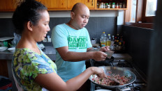 Meal time: Arie (left) and Heru Dwi Soesilo conduct a Sendok Kreatif Bali cooking and cost calculation session with Kini Bali. 