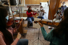 Venezuelan musicians, members of the Latin Vox Machine orchestra, perform 